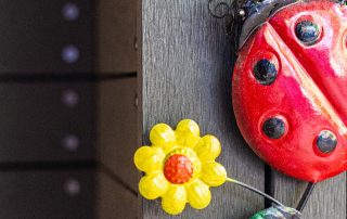 a ladybug and yellow flower decoration