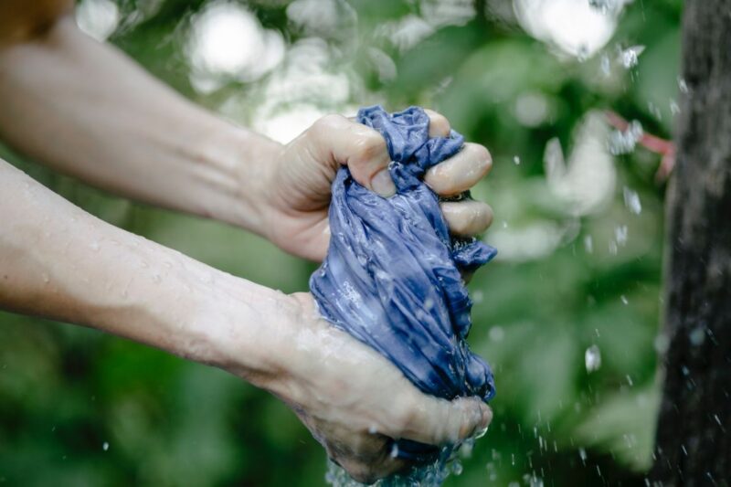 Preparing to hand wash outdoors