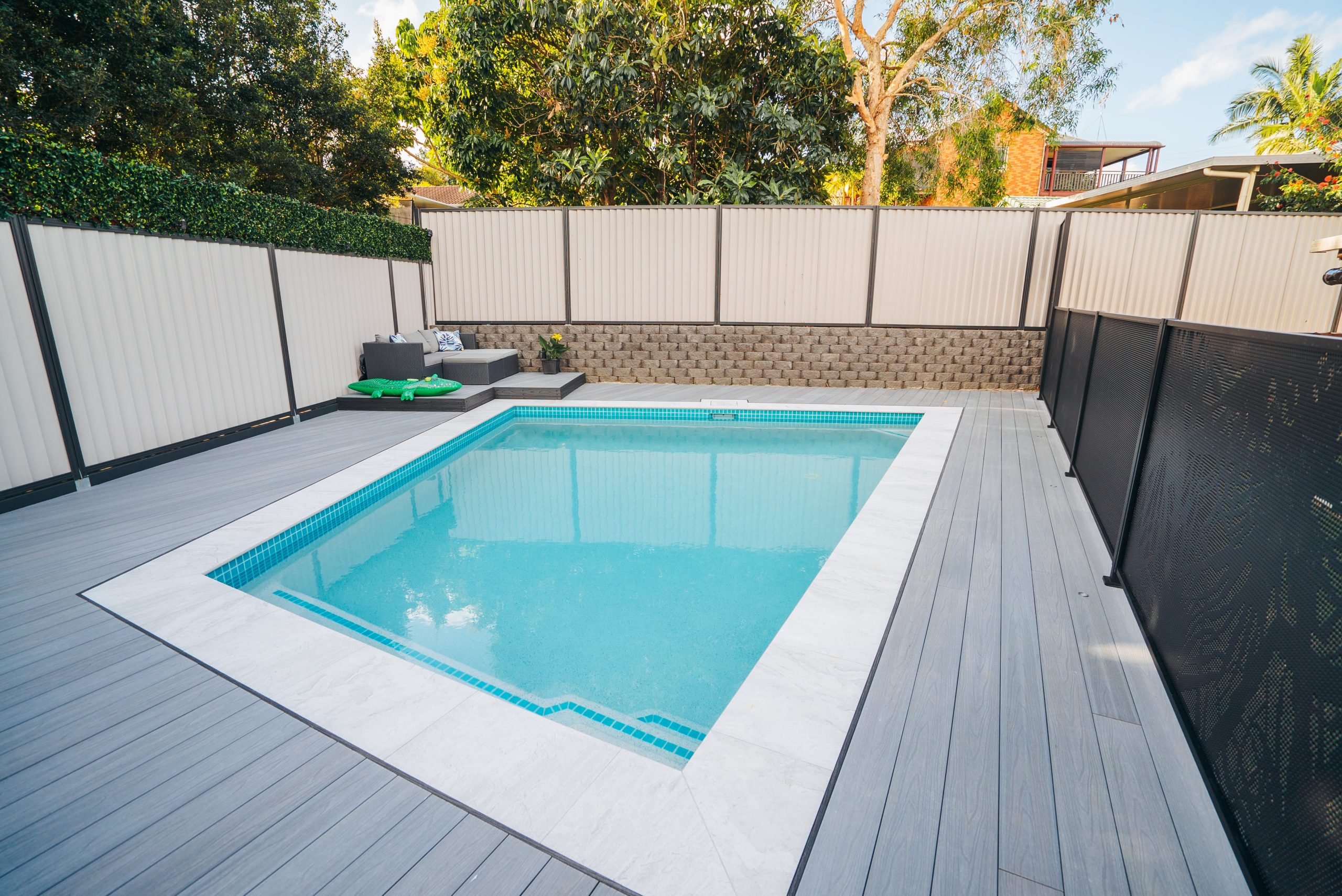 A composite decking surrounded pool
