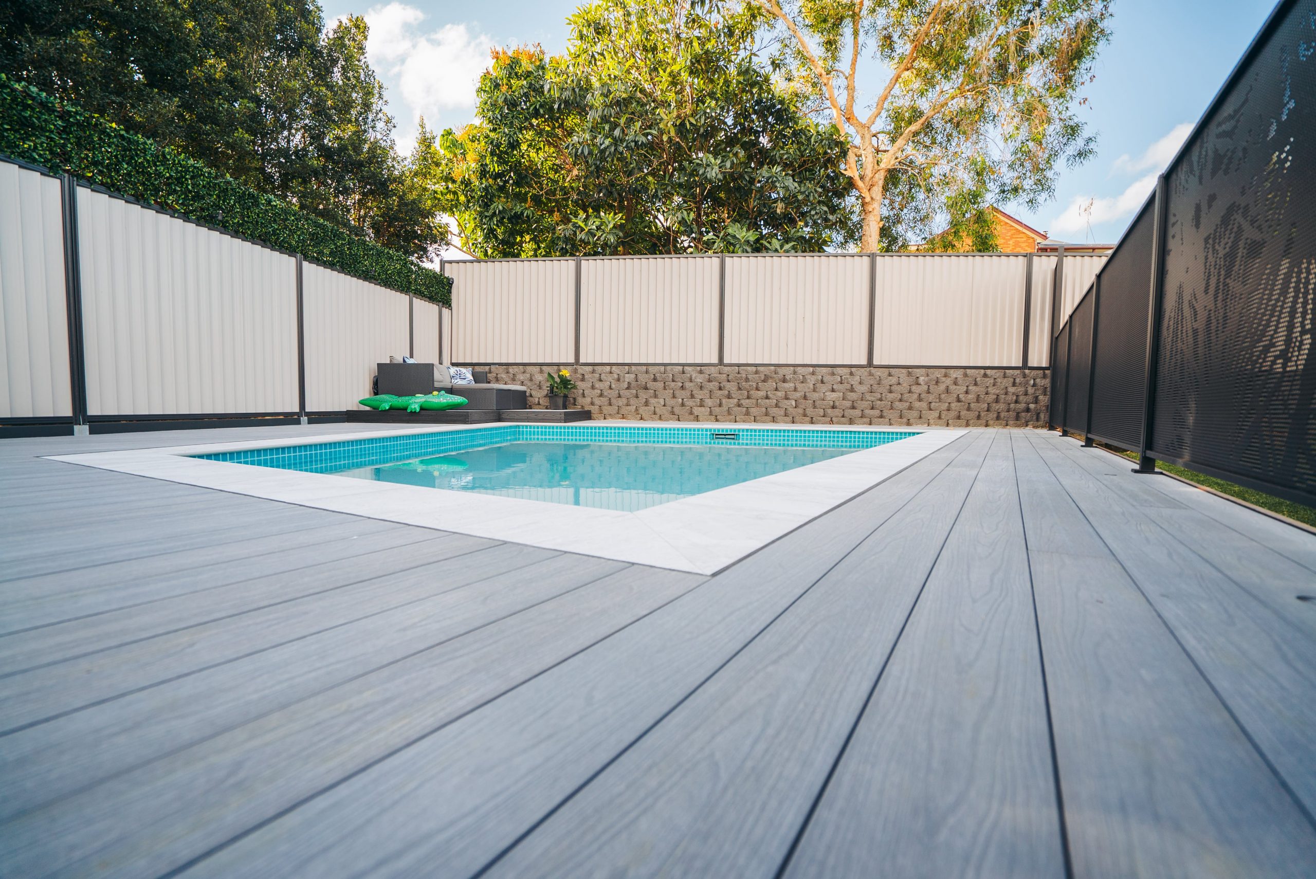 Mountain ash composite decking boards surrounding an in ground pool