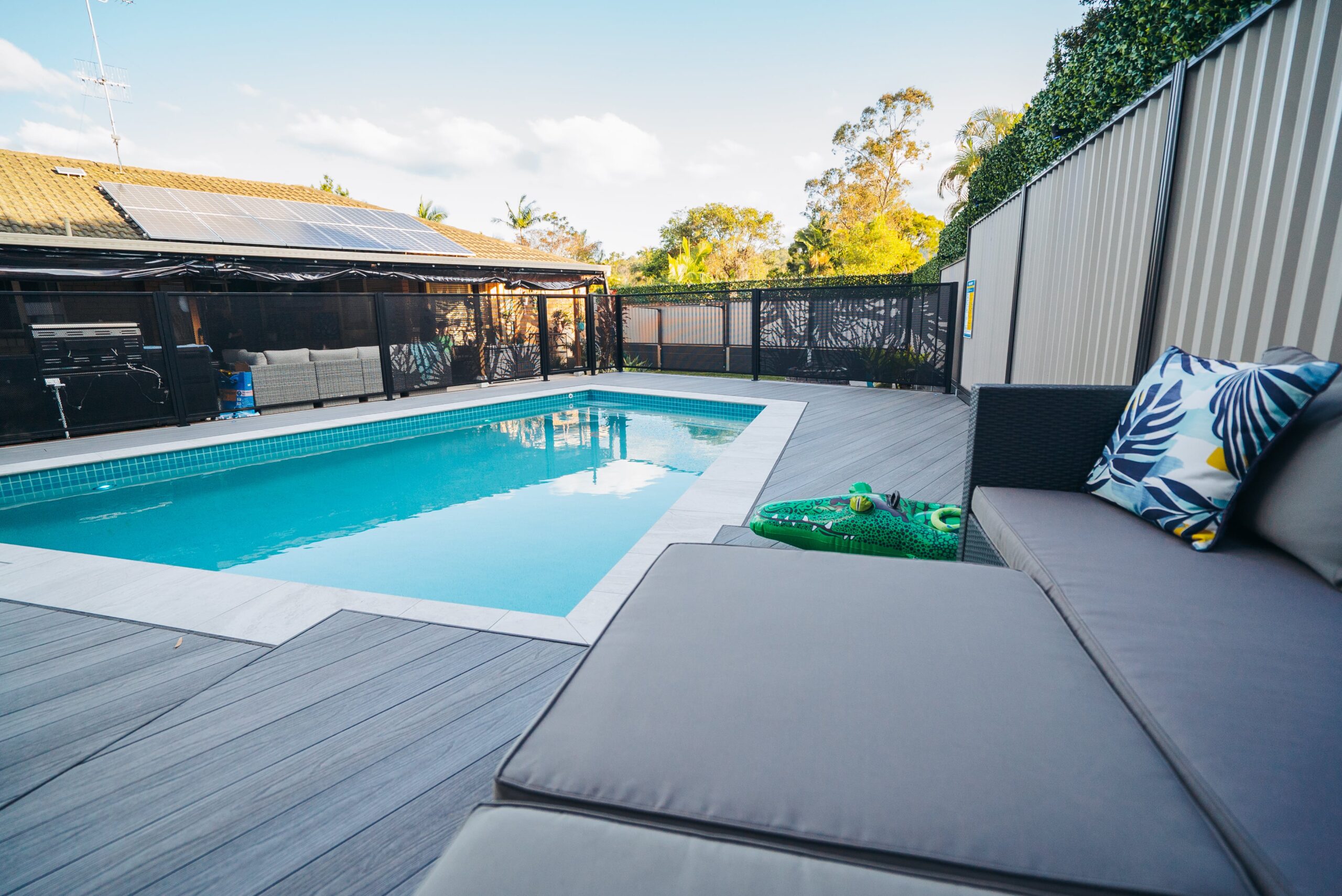 Mountain ash composite decking surrounding an in ground pool