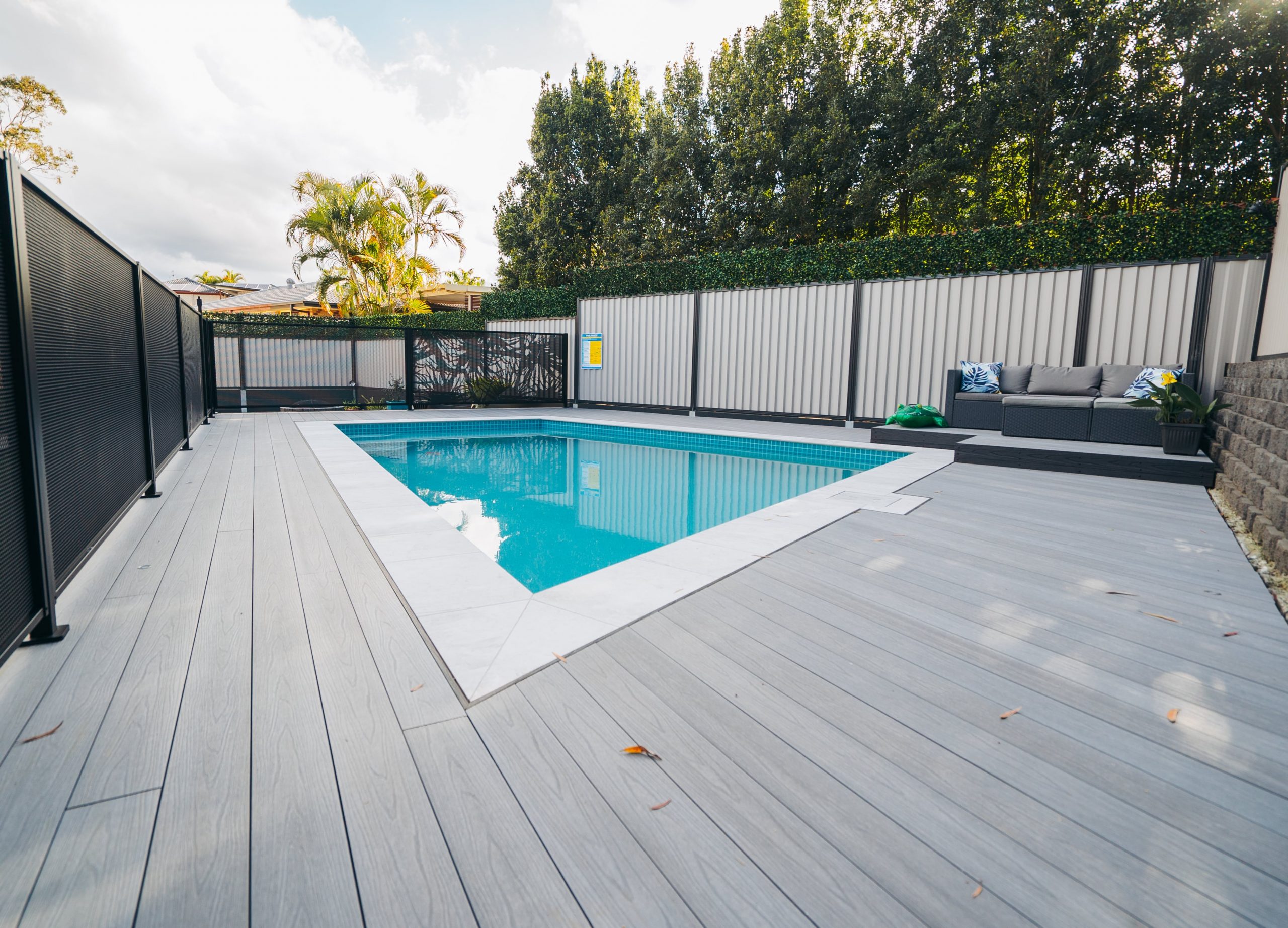 Mountain ash composite decking surrounding an in ground pool