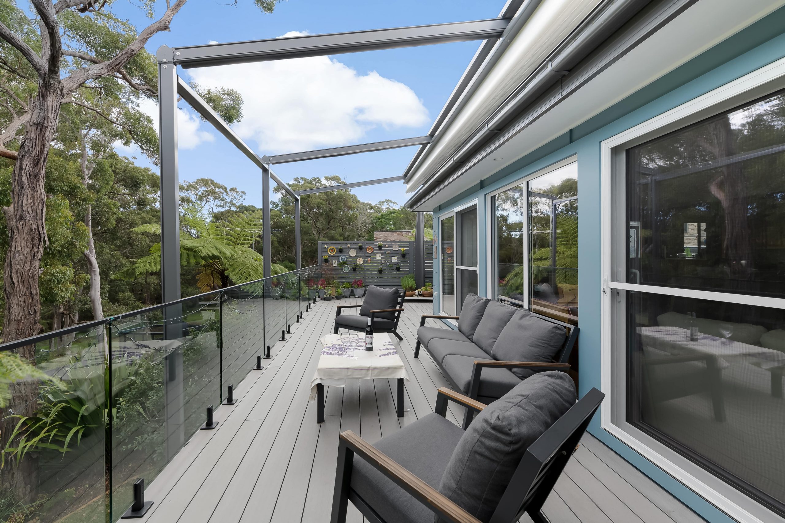 Mountain Ash composite deck with patio furniture on top