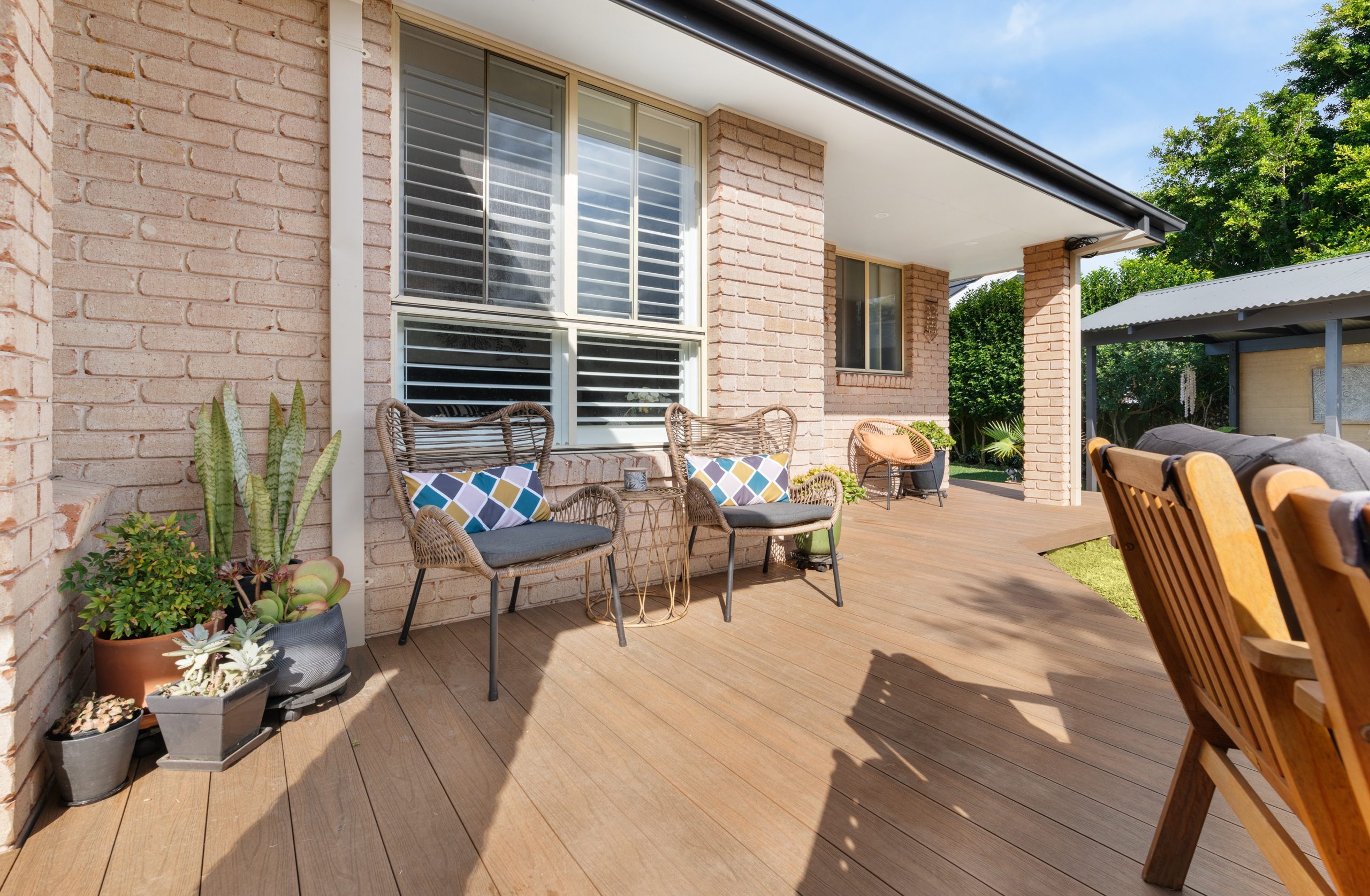 Natural composite decking boards on a finished outdoor patio