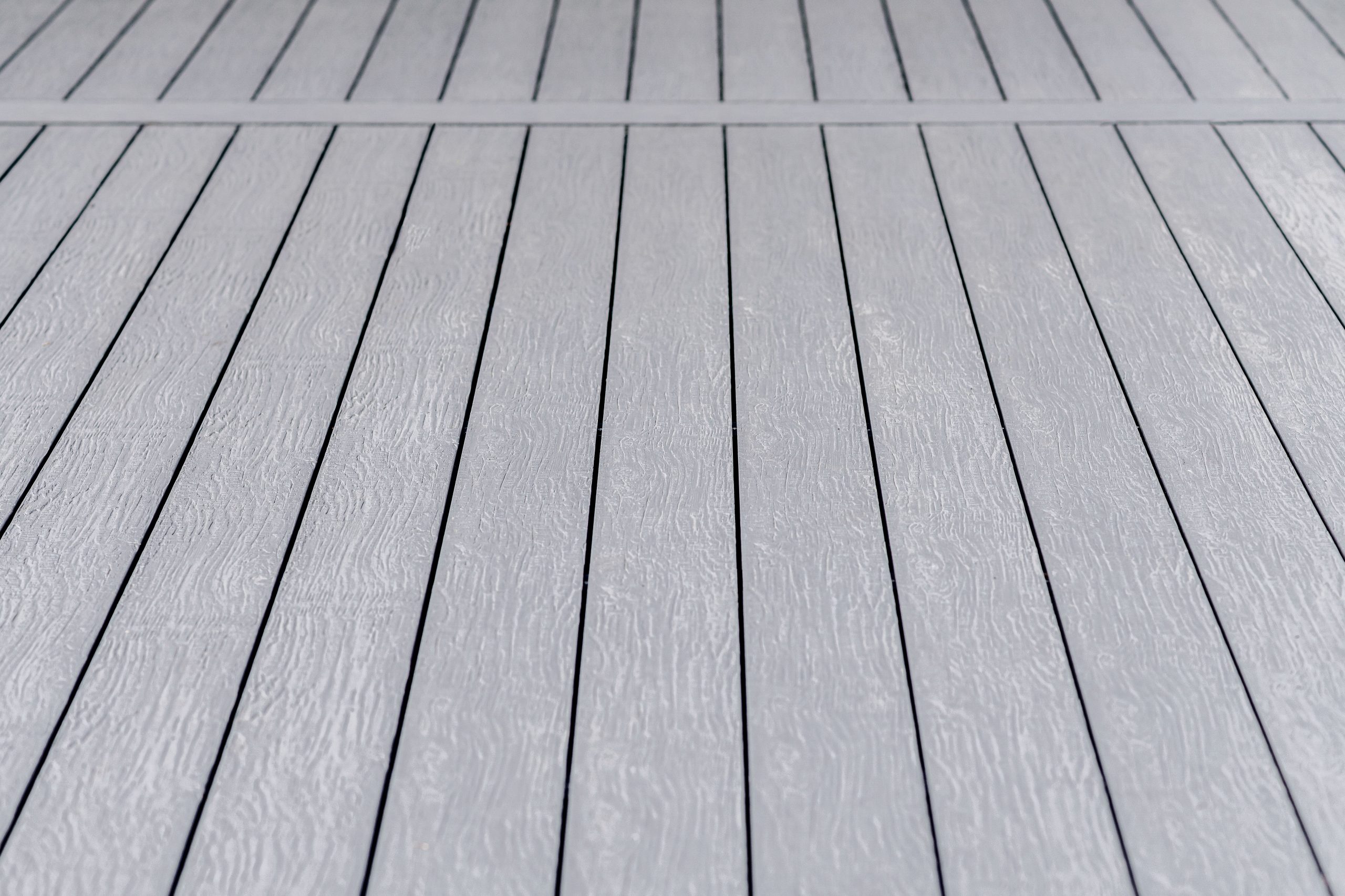 Old boat gray coloured composite decking board close up
