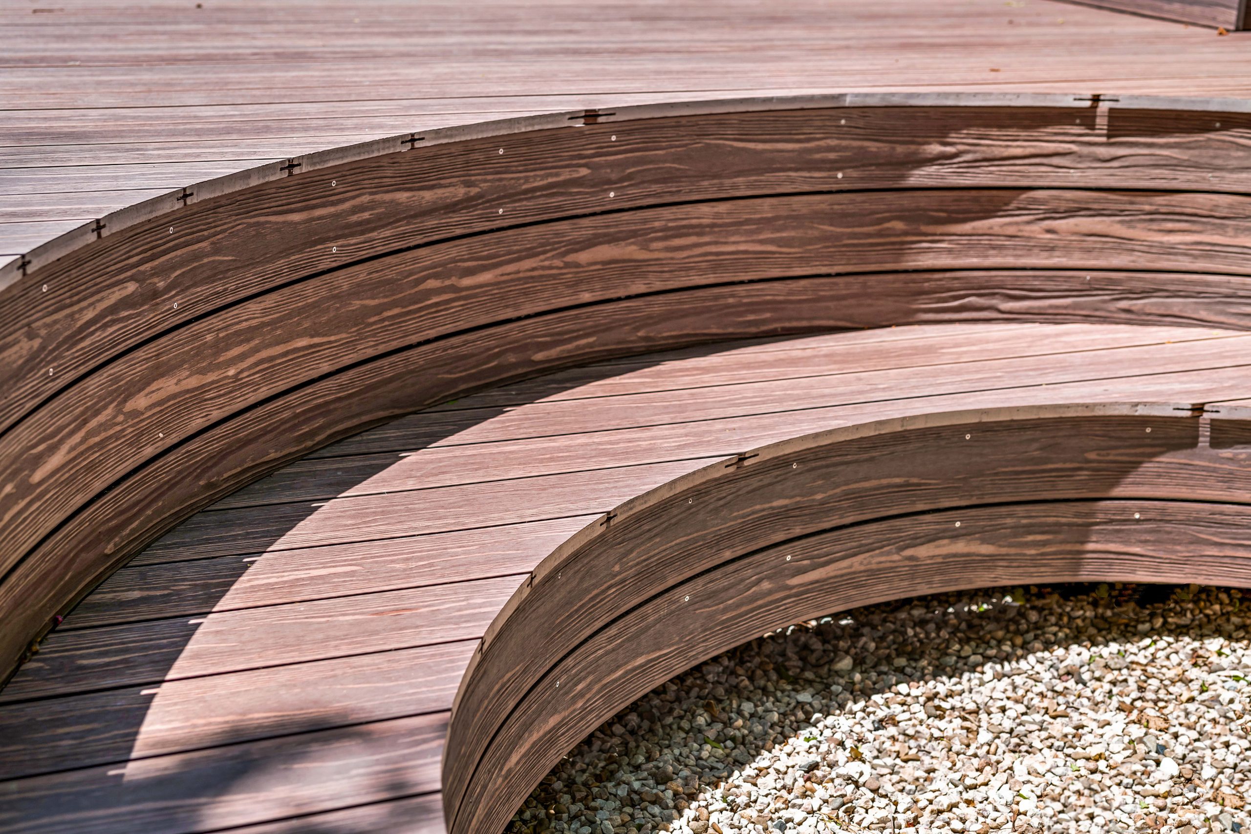 Outdoor composite deck seating in C-shape amphitheater style