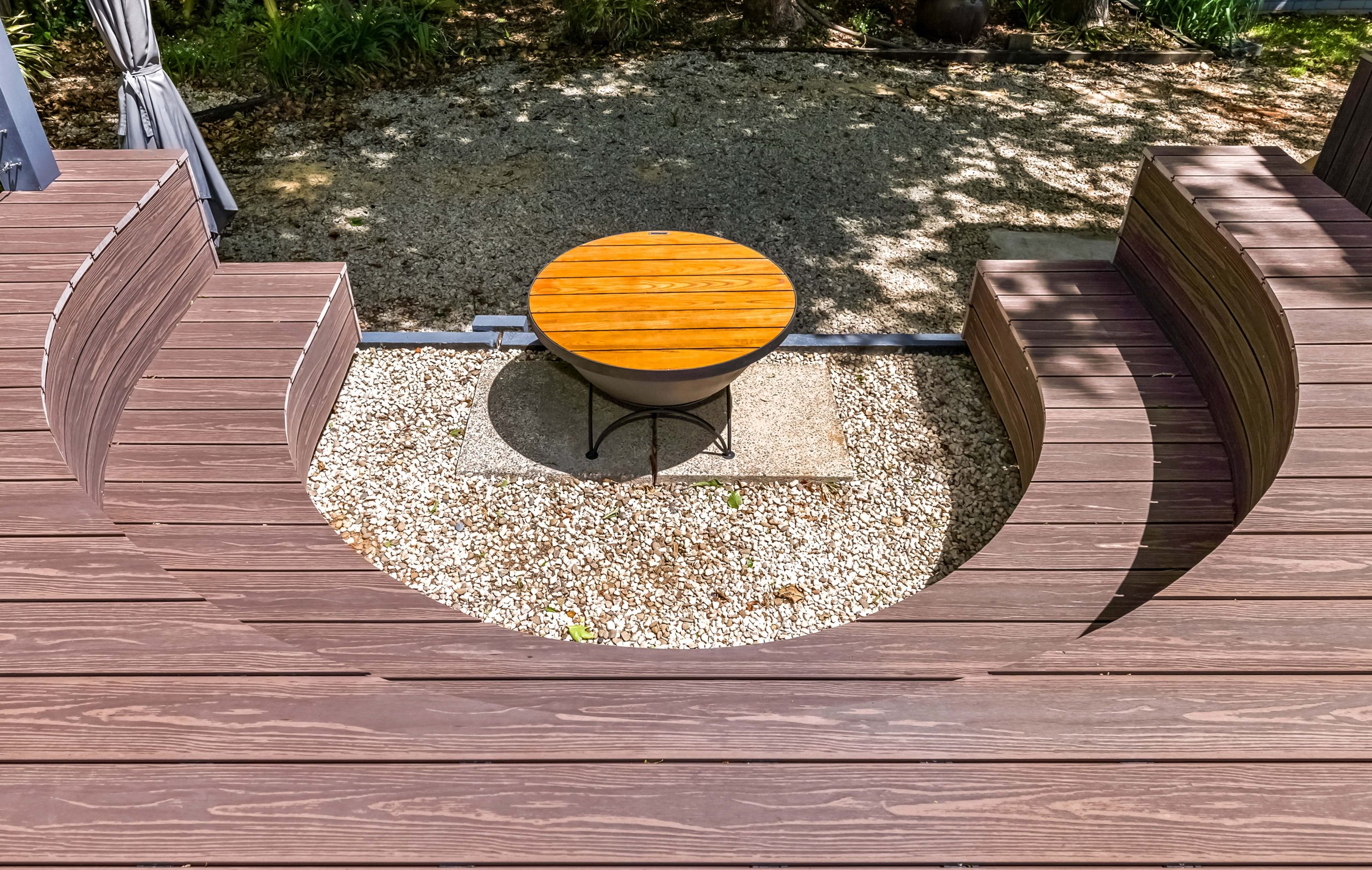 A U-shaped deck section, creating seating and room for BBQ