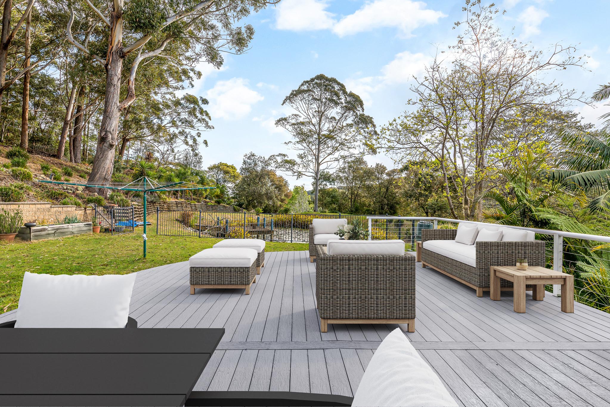 Old boat gray coloured composite decking boards decorated with modern patio furniture