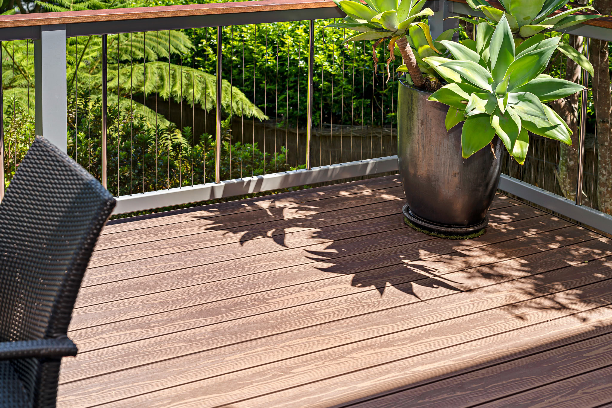 A potted plant sitting on top of brite composite decking boards