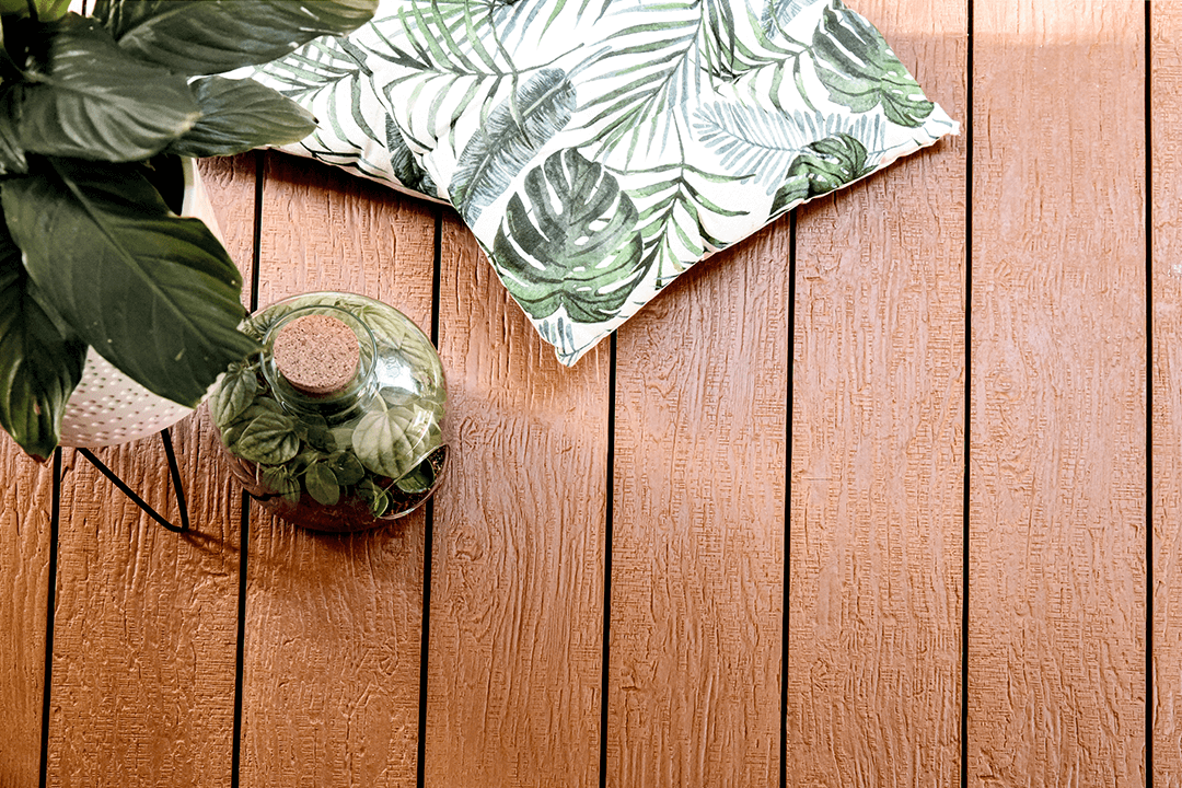 Plant decor complimenting the brown of old boat composite decking boards