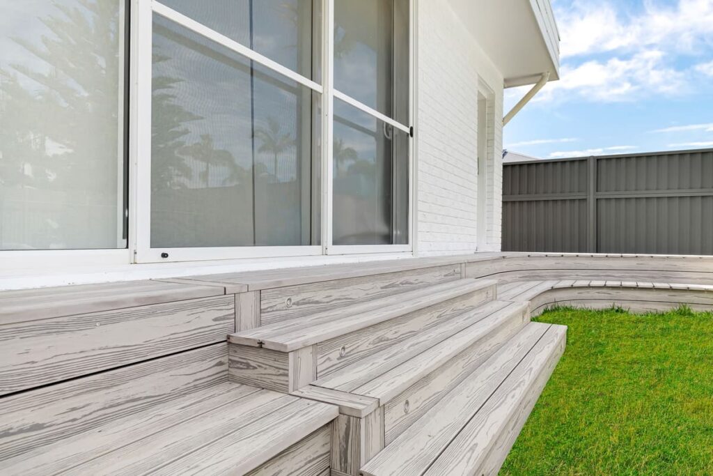 a grey composite decking steps on a house