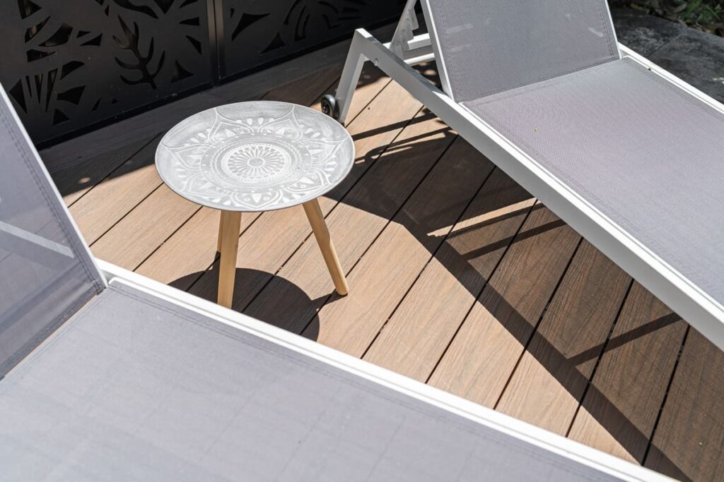 an image of a composite decking with table and chairs