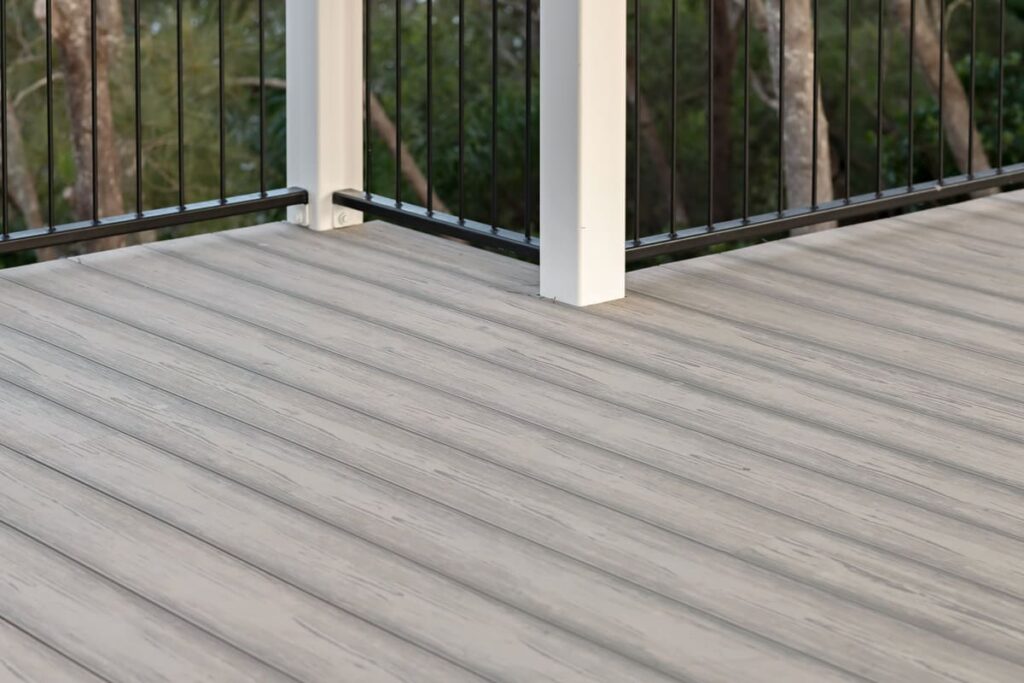 a grey composite dedeck with a railing