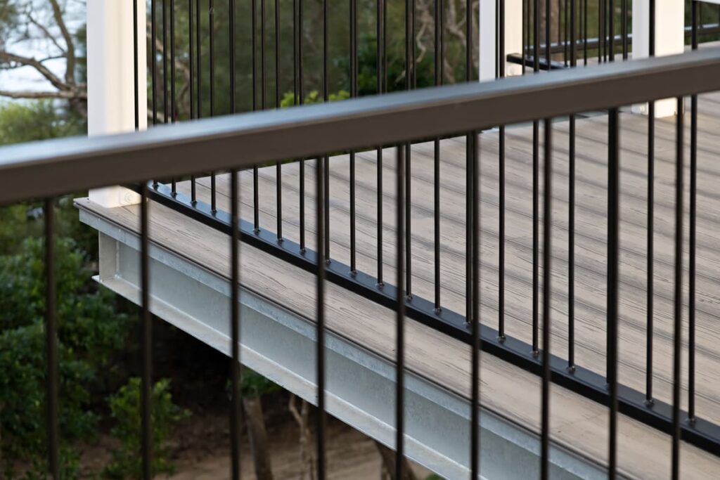 a railing on a grey composite deck