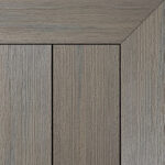 Composite decking board in Antique finish, weathered grey-brown tone with natural wood grain texture and framed corner detail.