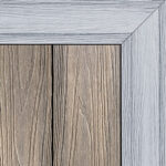 Double-sided composite decking board with Antique finish on one side and Smoke White finish on the other, featuring realistic wood grain textures and framed corner detail.