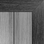 Double-sided composite decking board with Slate Grey finish on one side and Light Grey finish on the other, showcasing modern grey tones with subtle wood grain texture.
