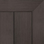 Composite decking board in Umber finish, dark brown tone with subtle wood grain texture and framed corner detail.