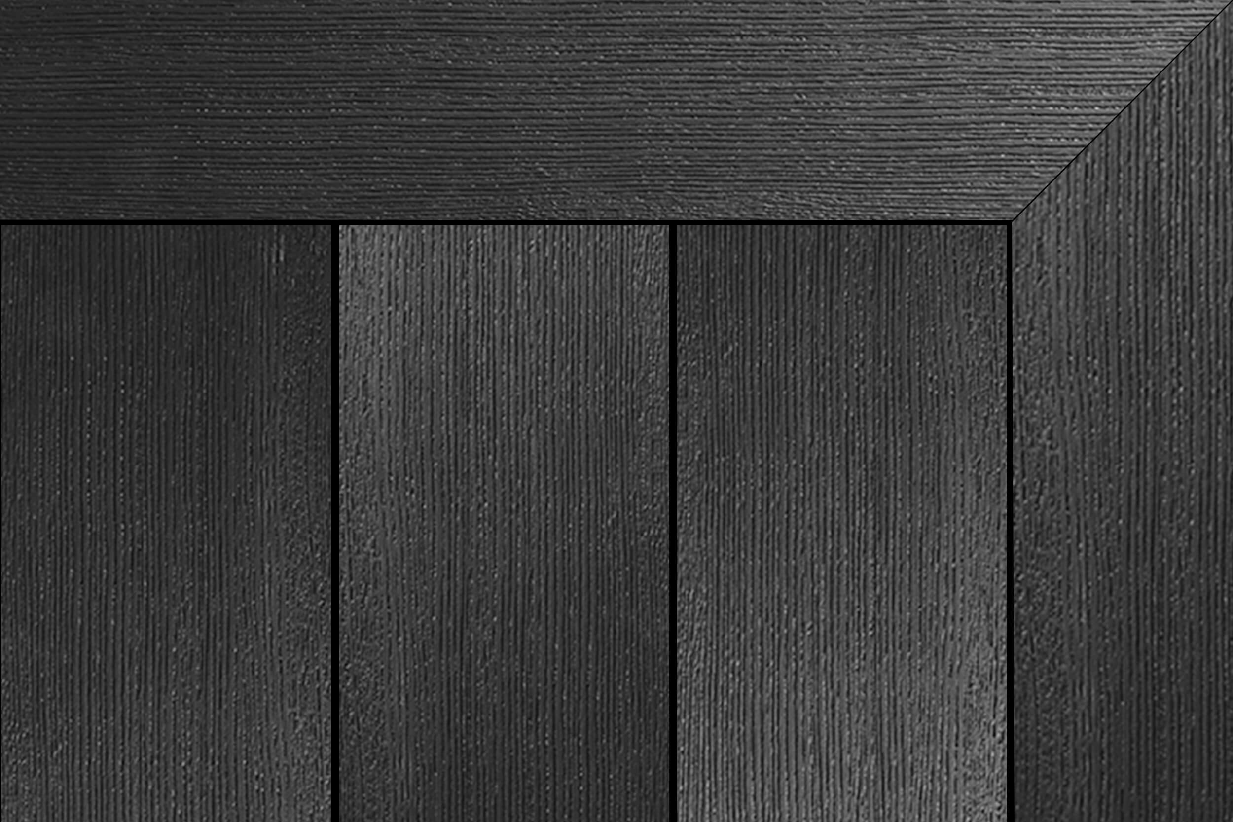 Charcoal grey composite decking with fine brushed grain and a mitered picture-frame border around three vertical boards.