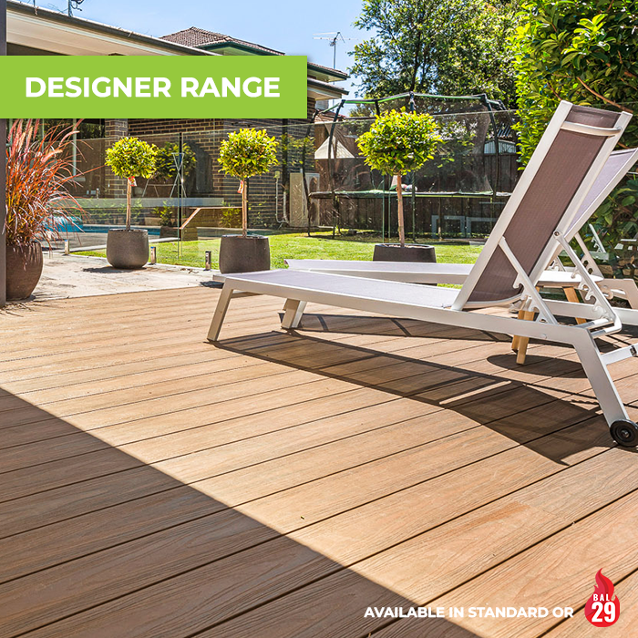 Modern backyard with warm brown composite decking from Brite Decking’s Designer Range, styled with a sun lounge and garden plants.