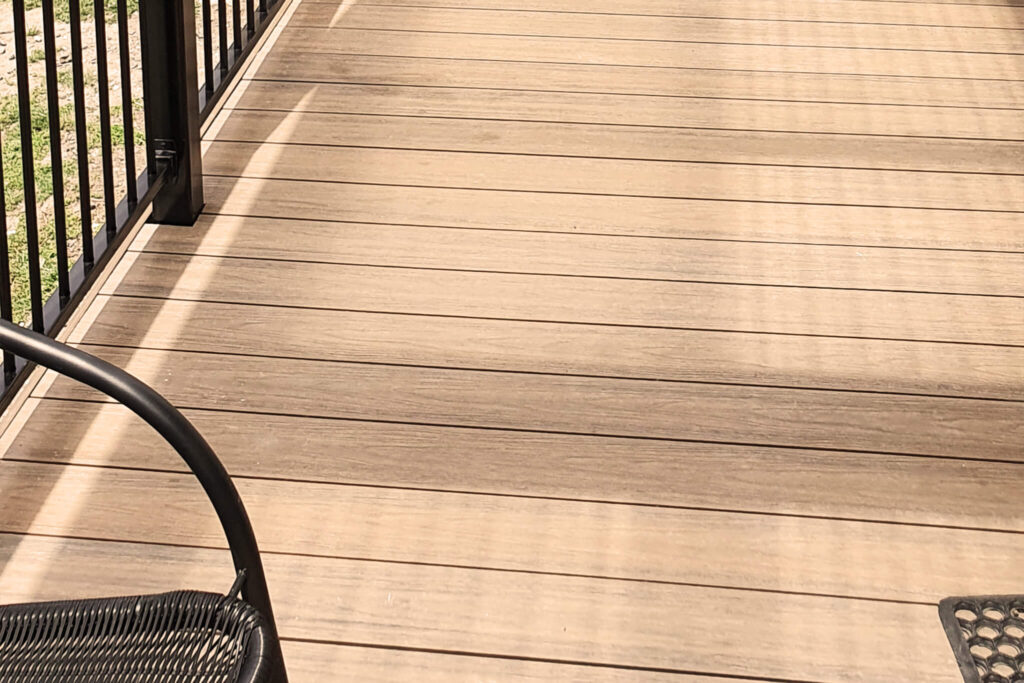 Close-up of composite decking Tasmania boards showing slip-resistant finish at Hobart holiday park.