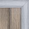 Double-sided composite decking board with Antique finish on one side and Smoke White finish on the other, featuring realistic wood grain textures and framed corner detail.